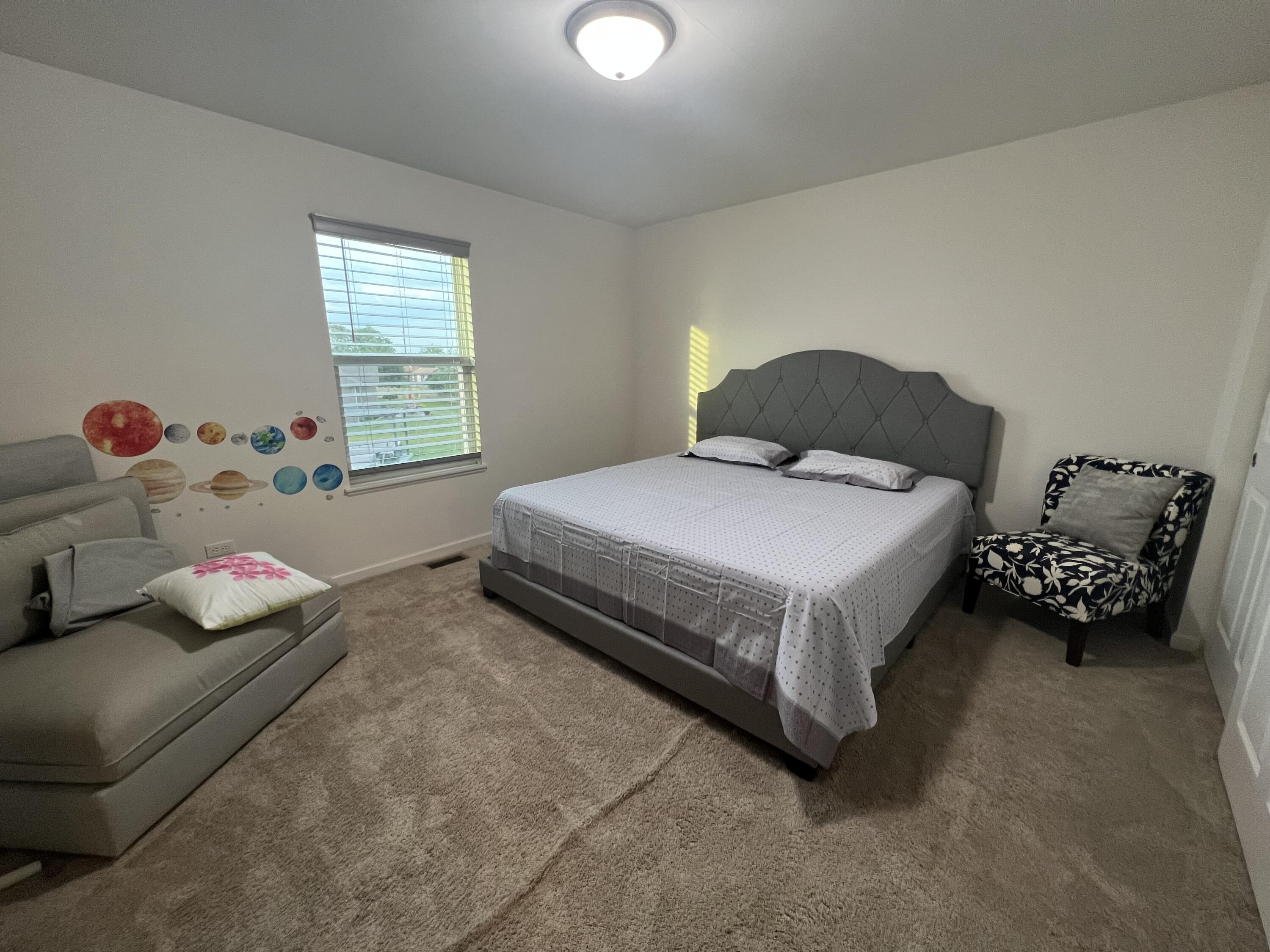 10193 California Street Crown Point, IN 46307 - Photo 27 of 33 a bedroom with a bed and a window