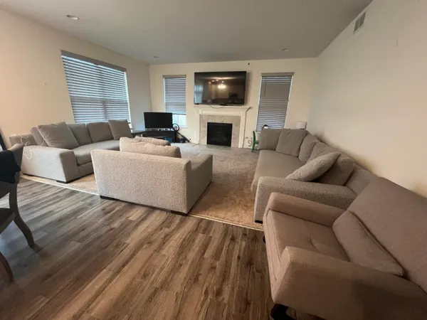 a large kitchen with a table and chairs