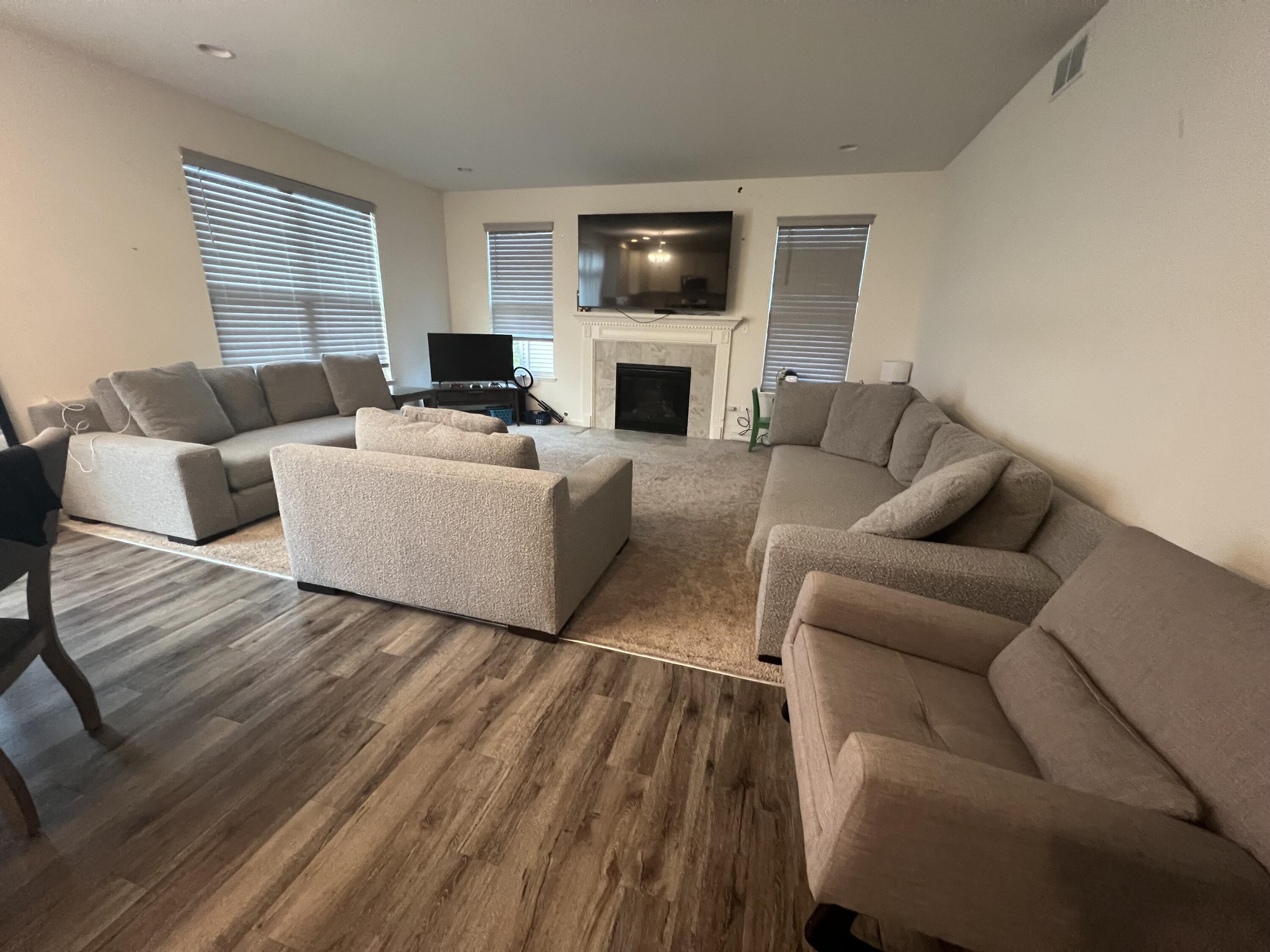 10193 California Street Crown Point, IN 46307 - Photo 28 of 33 a living room with furniture fireplace and flat screen tv
