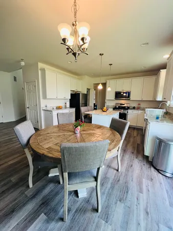 a view of a dining room and a chandelier
