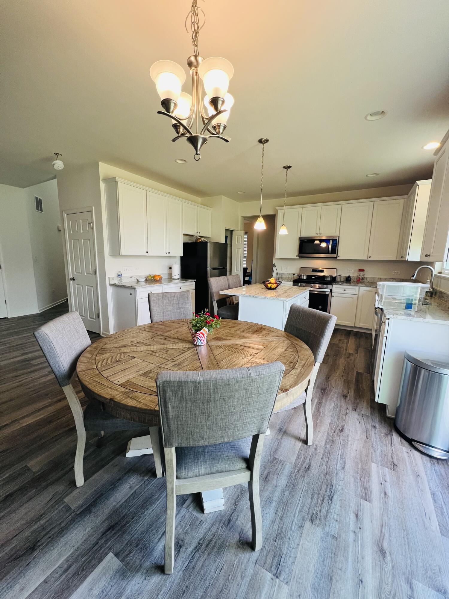 10193 California Street Crown Point, IN 46307 - Photo 29 of 33 a large kitchen with a table and chairs