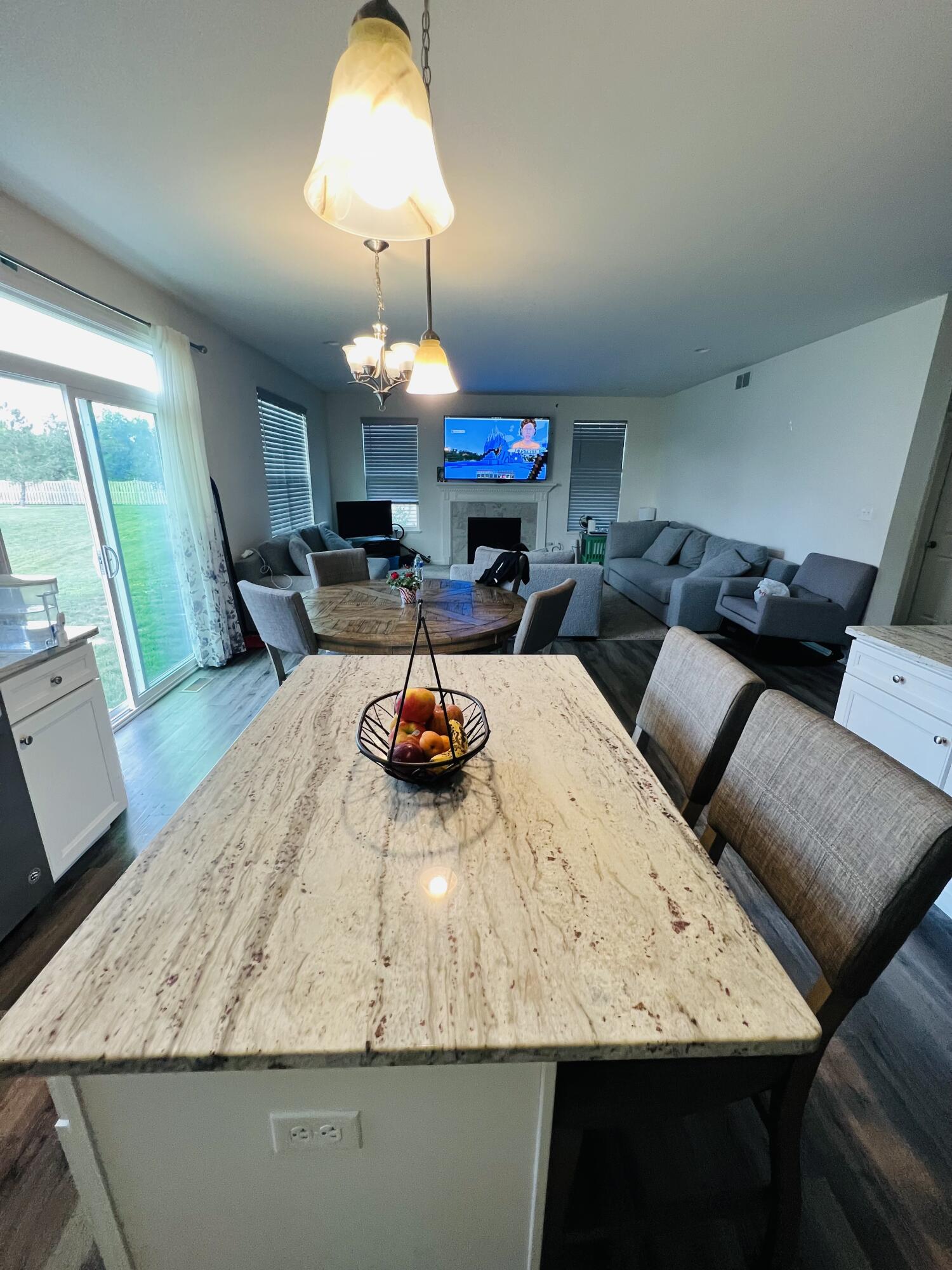 10193 California Street Crown Point, IN 46307 - Photo 30 of 33 a view of a dining room and a chandelier