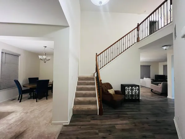 a lobby with furniture and rug