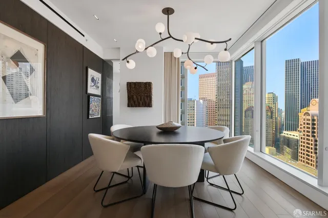 a view of a dining room with furniture window and wooden floor