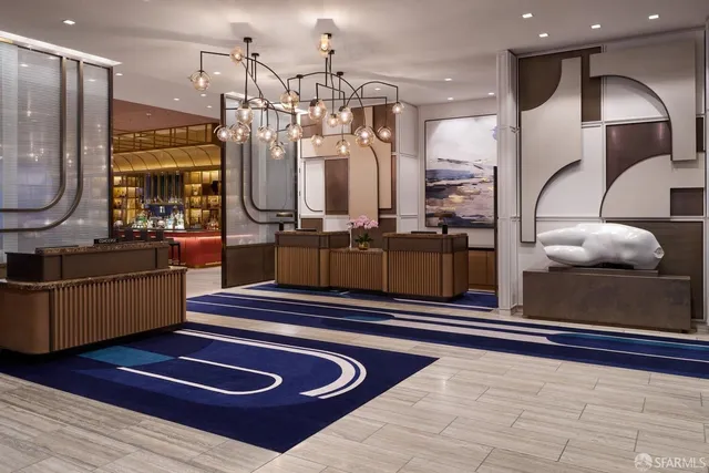 a lobby with furniture and wooden floor