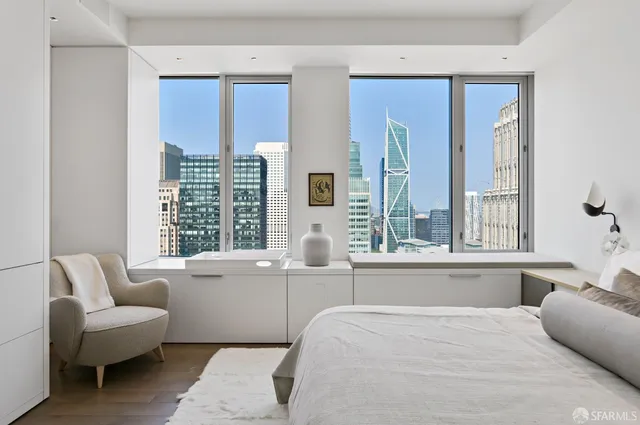 a bedroom with furniture and windows