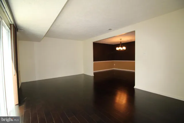 a view of a livingroom with wooden floor