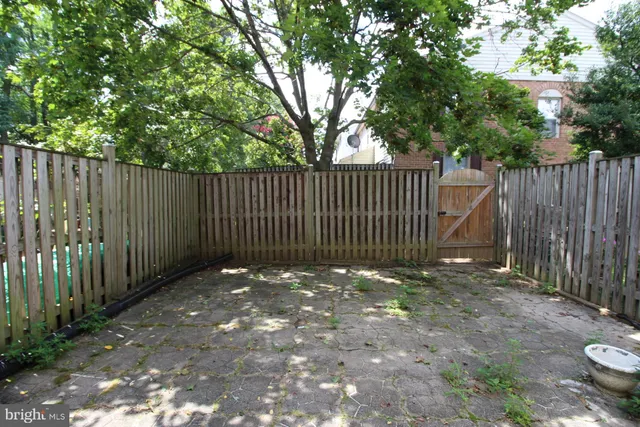 a view of outdoor space with wooden fence