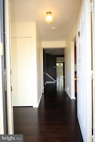 a view of gallery with wooden floor