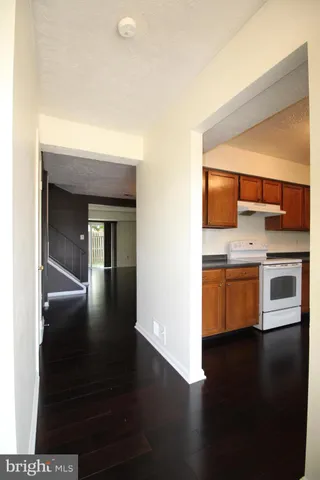 a kitchen with stainless steel appliances a refrigerator and a stove
