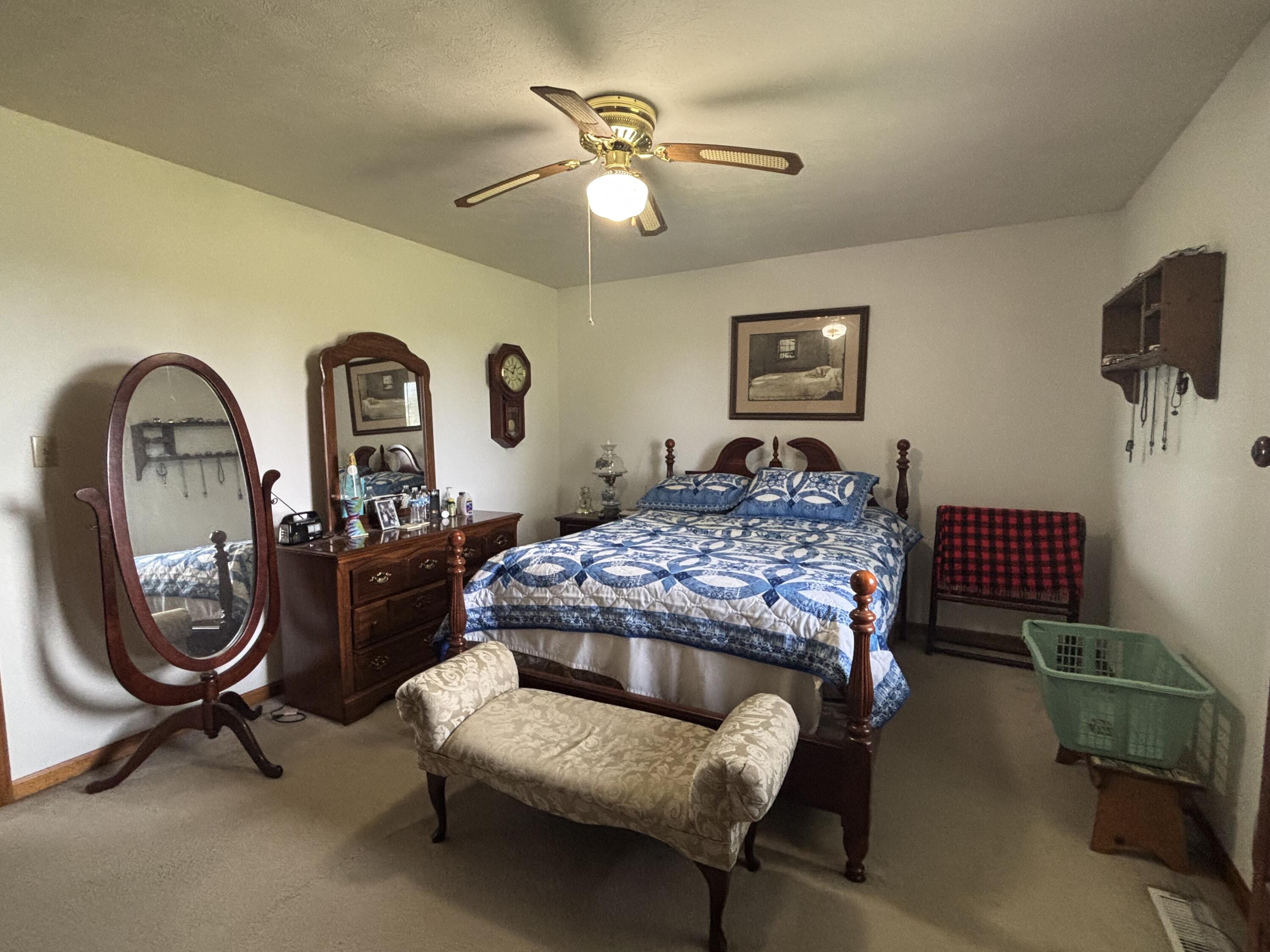 8193 Oak Tree Drive Rensselaer, IN 47978 - Photo 11 of 29 a bedroom with a bed and a chandelier