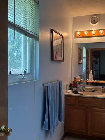 a bath tub sitting next to a white sink