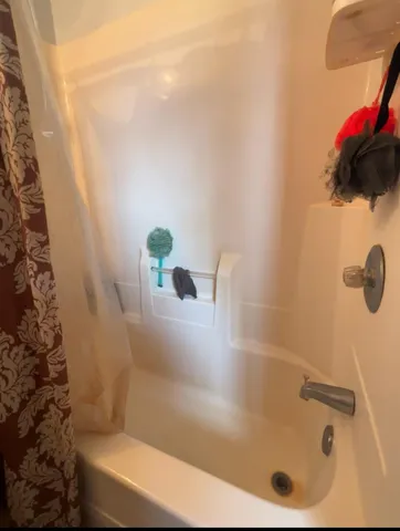 a bed room with a bed and a night stand