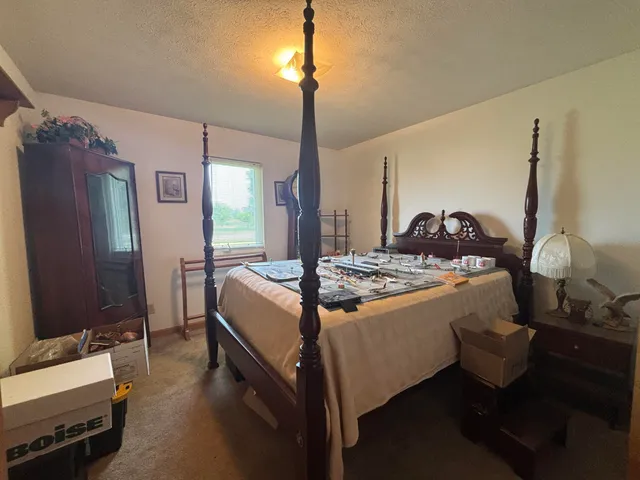 a living room with furniture and a mirror