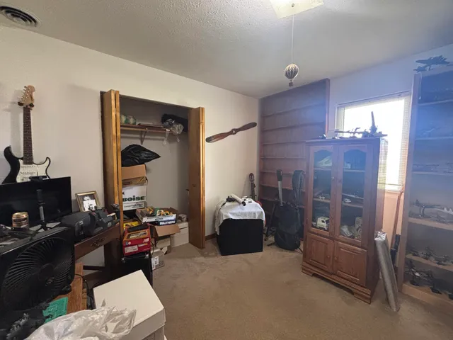 a bathroom with a sink mirror vanity and toilet