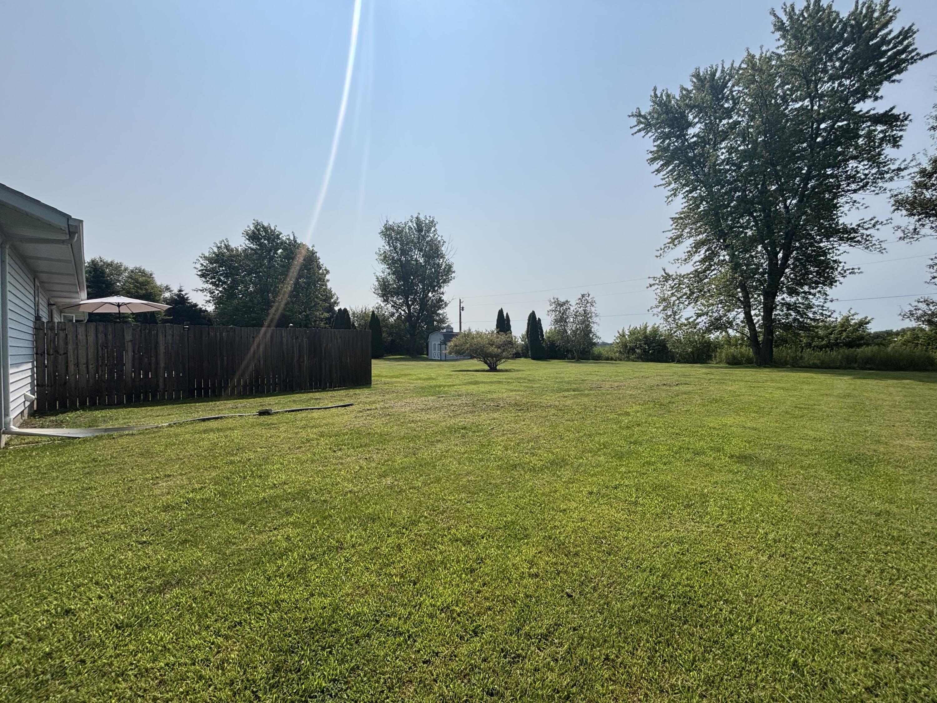 8193 Oak Tree Drive Rensselaer, IN 47978 - Photo 22 of 29 a view of a field of grass and trees