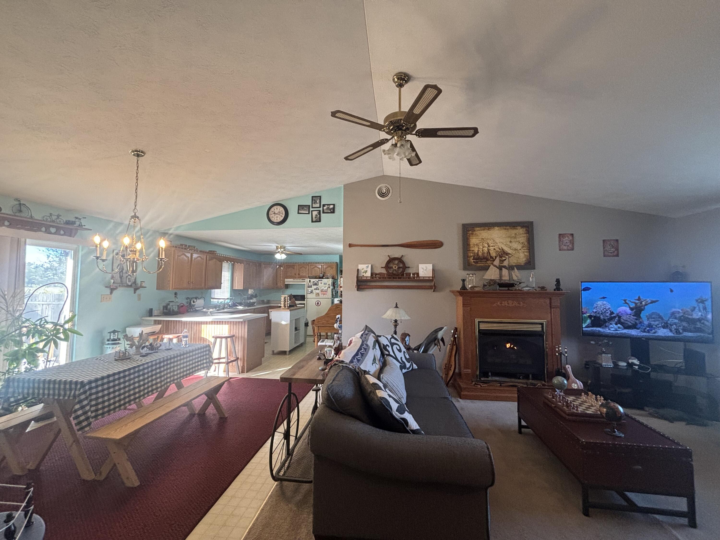 8193 Oak Tree Drive Rensselaer, IN 47978 - Photo 3 of 29 a living room with furniture and a fireplace