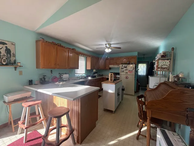 a kitchen with cabinets a sink and appliances