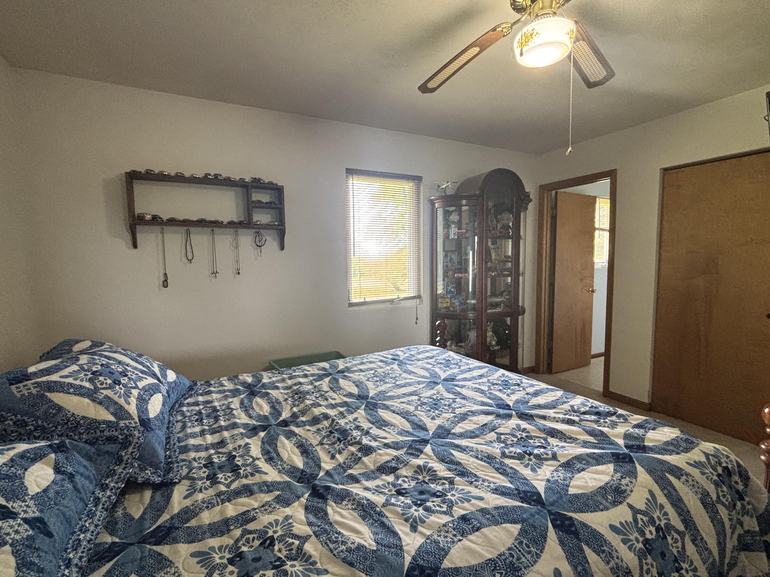 8193 Oak Tree Drive Rensselaer, IN 47978 - Photo 10 of 29 a bedroom with a bed and a chandelier