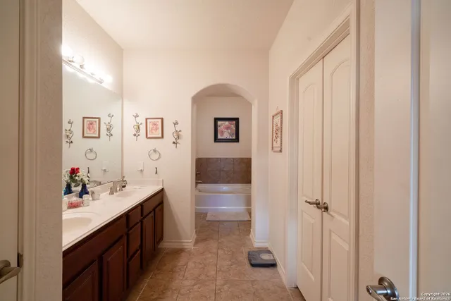 a bathroom with a sink and mirror