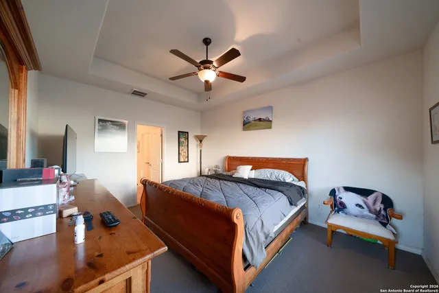 a bed room with a bed and a chandelier