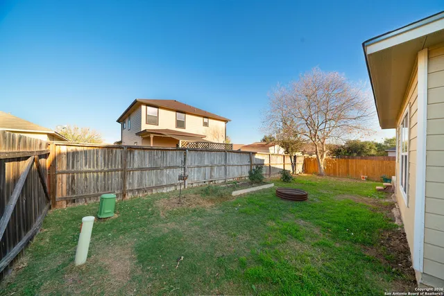 a view of a backyard with a garden and plants