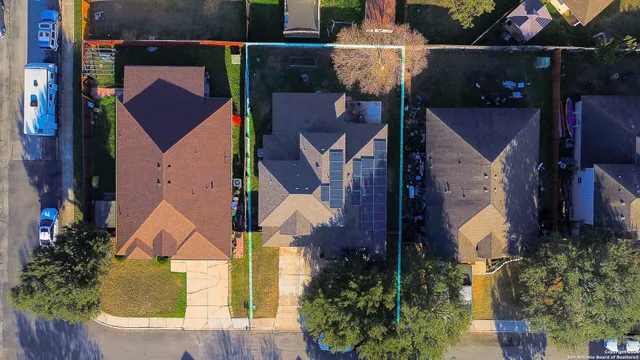 an aerial view of houses with yard