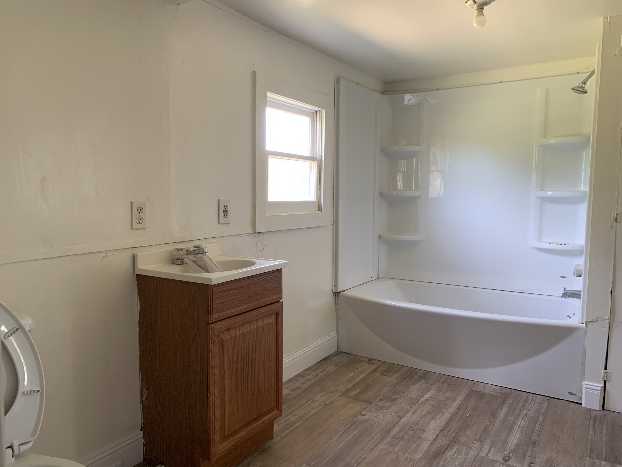 5580 Galen Road Lafayette, TN 37083 - Photo 11 of 16 a bathroom with a bathtub sink and mirror