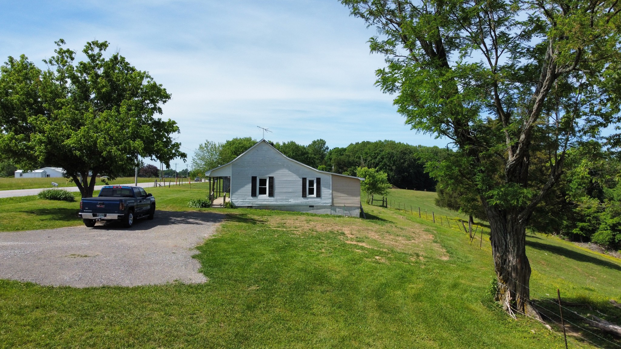 5580 Galen Road Lafayette, TN 37083 - Photo 14 of 16 a view of house with outdoor seating and green space