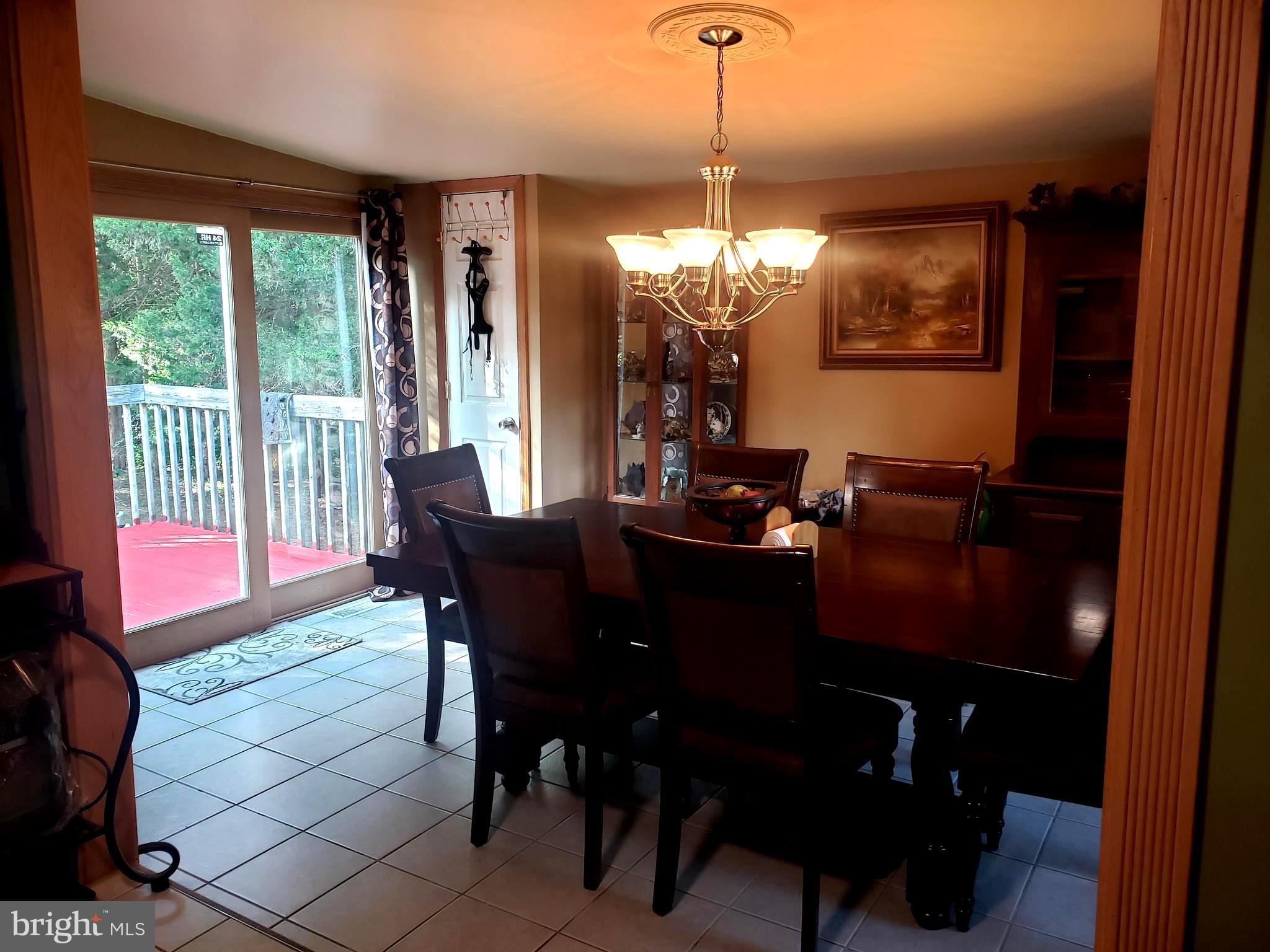 27 Mackeys Lane Leesburg, NJ 08327 - Photo 11 of 29 a view of a dining room with furniture window and outside view