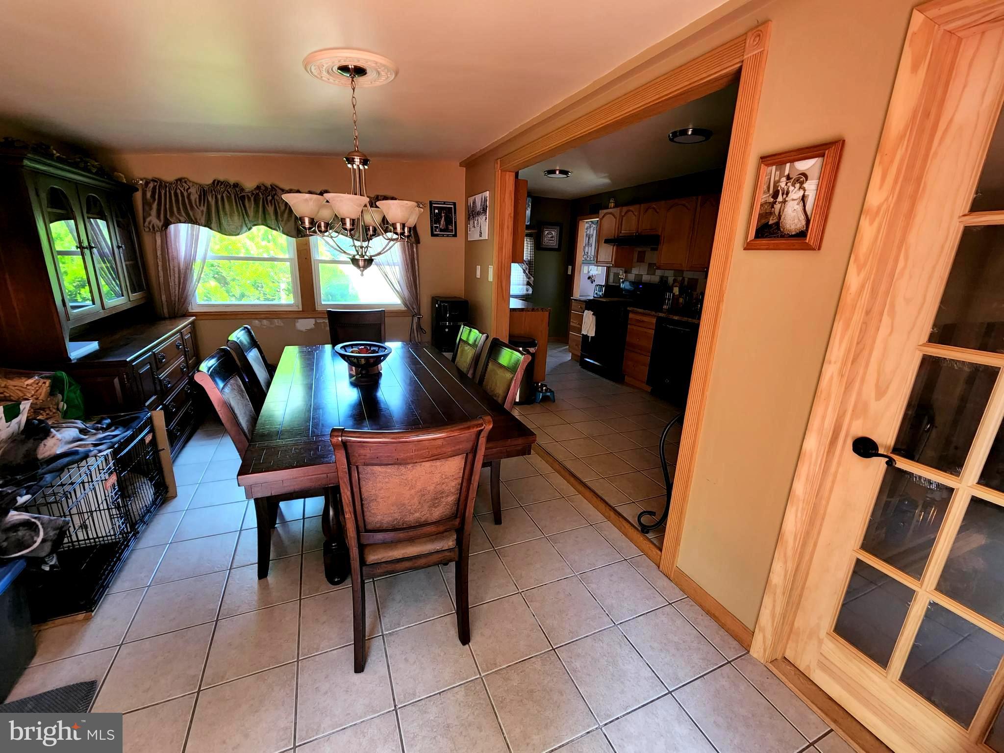 27 Mackeys Lane Leesburg, NJ 08327 - Photo 12 of 29 a living room with furniture and a flat screen tv