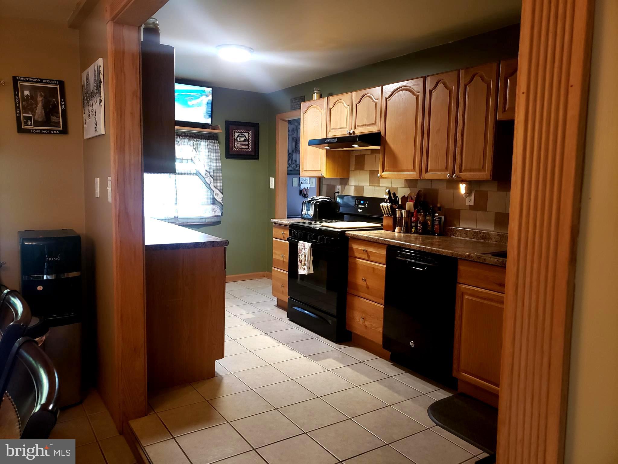 27 Mackeys Lane Leesburg, NJ 08327 - Photo 13 of 29 a kitchen with stainless steel appliances granite countertop a refrigerator and a sink