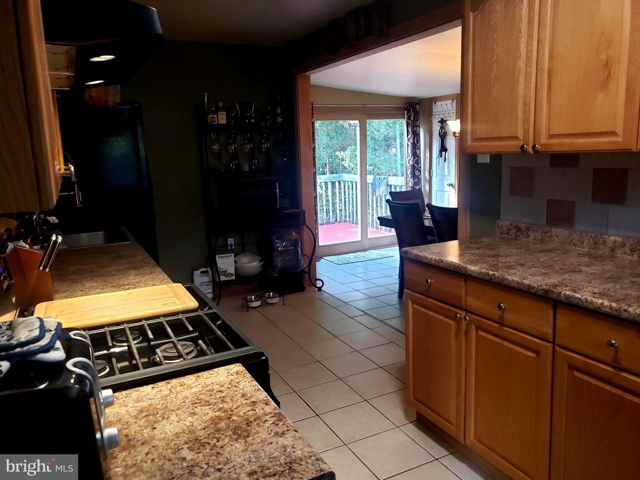 27 Mackeys Lane Leesburg, NJ 08327 - Photo 14 of 29 a kitchen with sink and cabinets