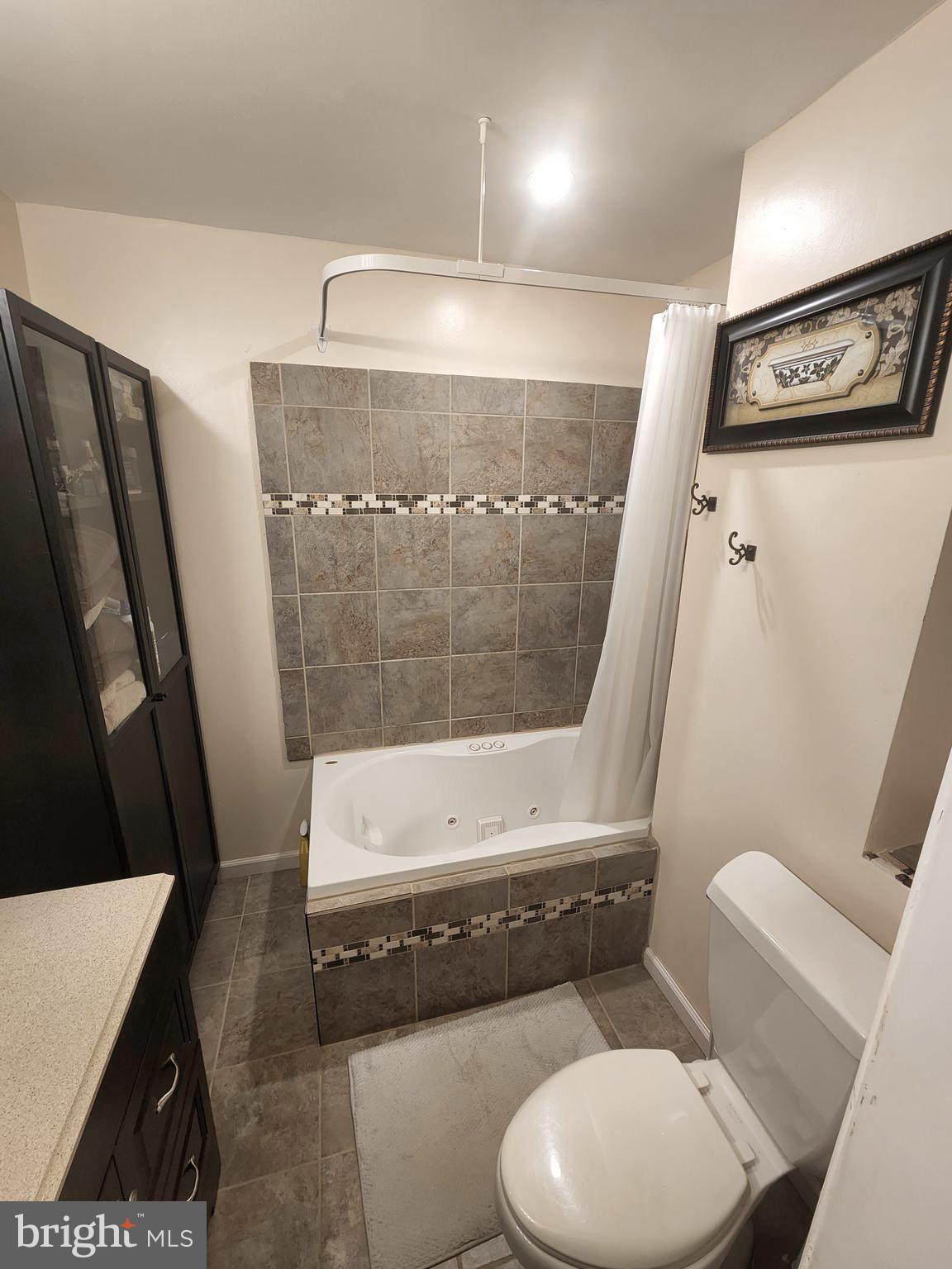 27 Mackeys Lane Leesburg, NJ 08327 - Photo 19 of 29 a bathroom with a toilet and a shower