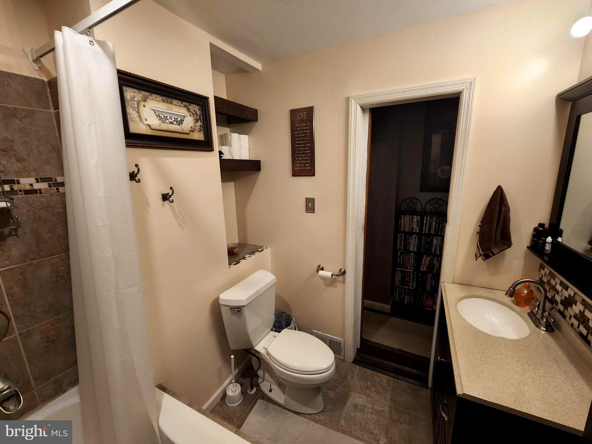 27 Mackeys Lane Leesburg, NJ 08327 - Photo 20 of 29 a white toilet sitting next to a bathroom sink