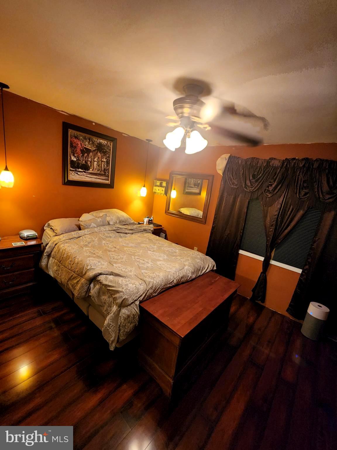 27 Mackeys Lane Leesburg, NJ 08327 - Photo 21 of 29 a bedroom with a bed and a lamp on dresser