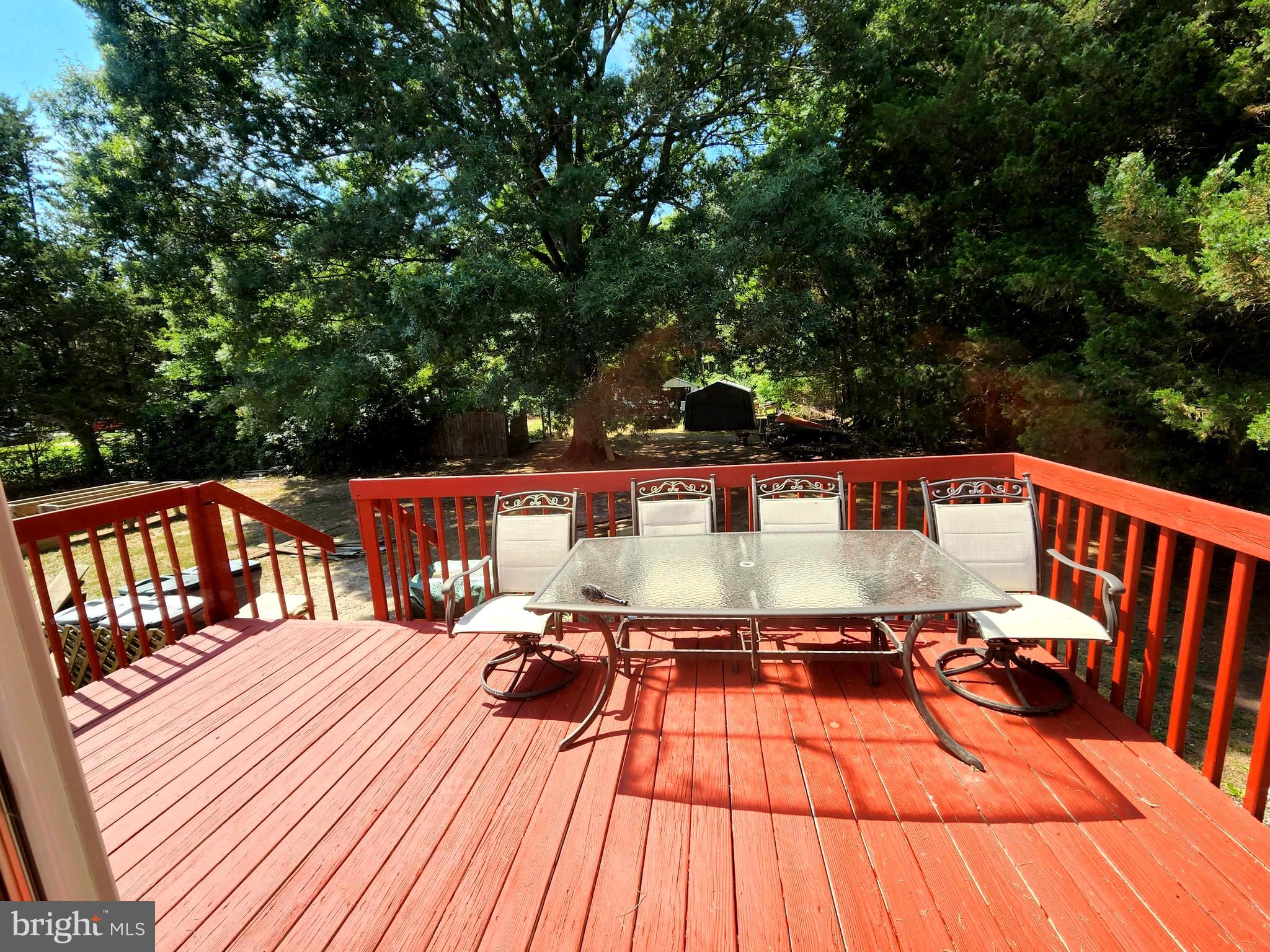 27 Mackeys Lane Leesburg, NJ 08327 - Photo 5 of 29 a outdoor view with sitting space and trees