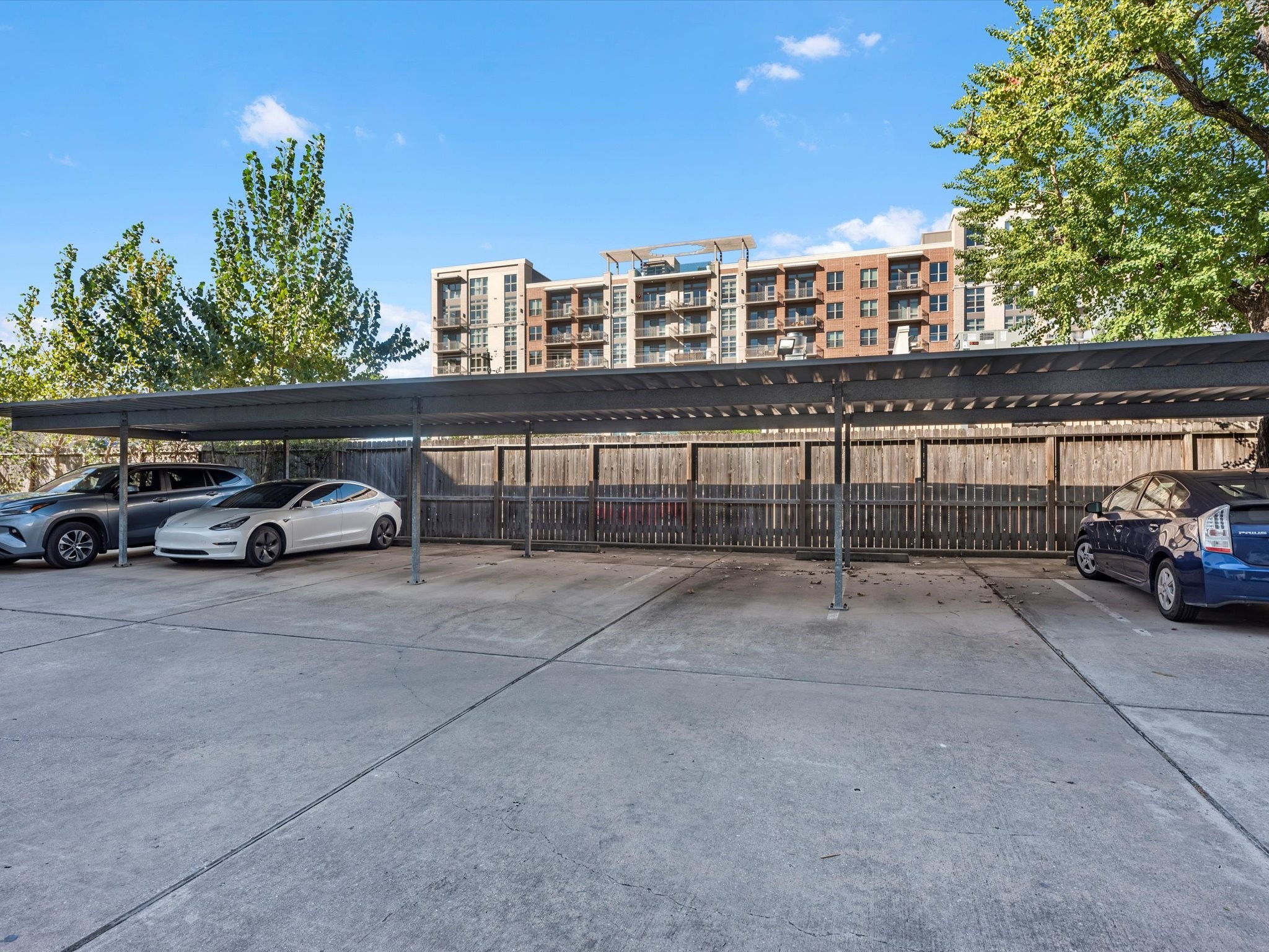 1406 Columbus Street, Unit 303 Houston, TX 77019 - Photo 17 of 17 a view of a car parked in front of a building