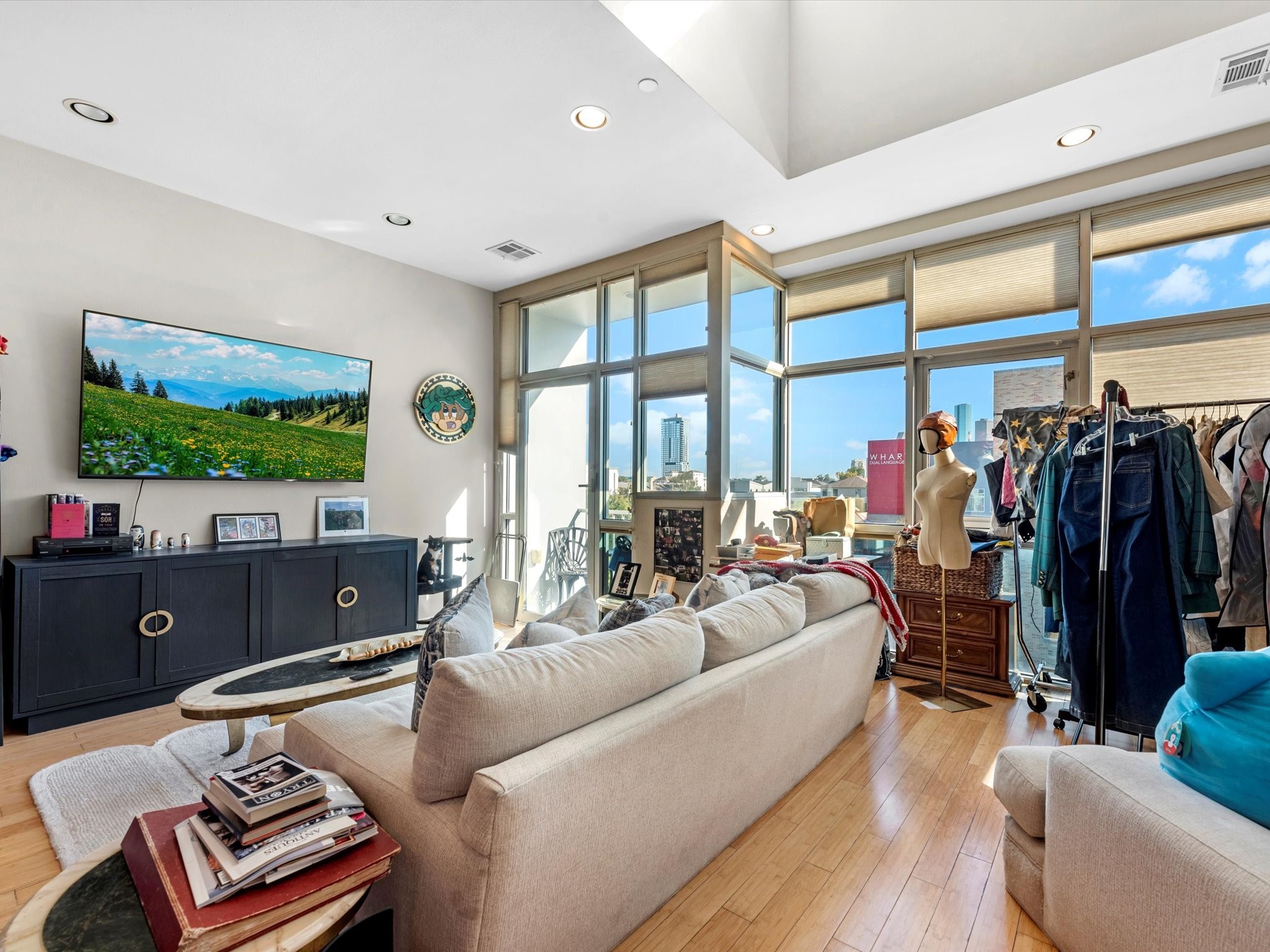 1406 Columbus Street, Unit 303 Houston, TX 77019 - Photo 4 of 17 a living room with furniture and a flat screen tv