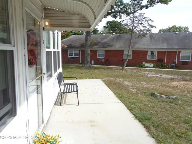 a view of a porch with a backyard