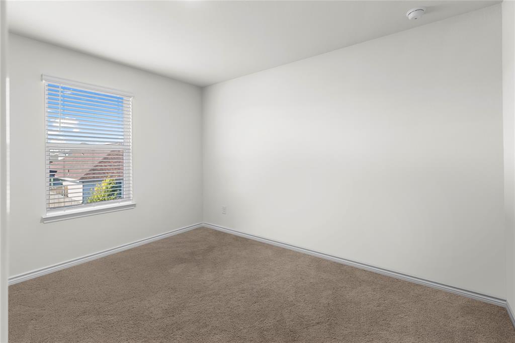 401 Thompson Place Everman, TX 76140 - Photo 18 of 23 an empty room with a window