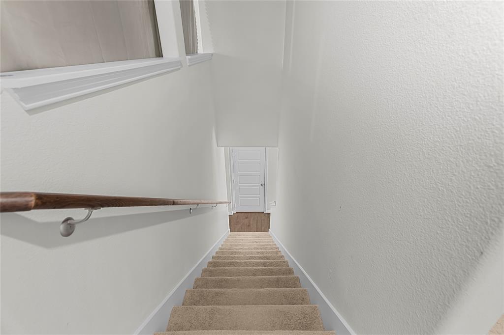 401 Thompson Place Everman, TX 76140 - Photo 22 of 23 a walk in closet with wooden floor