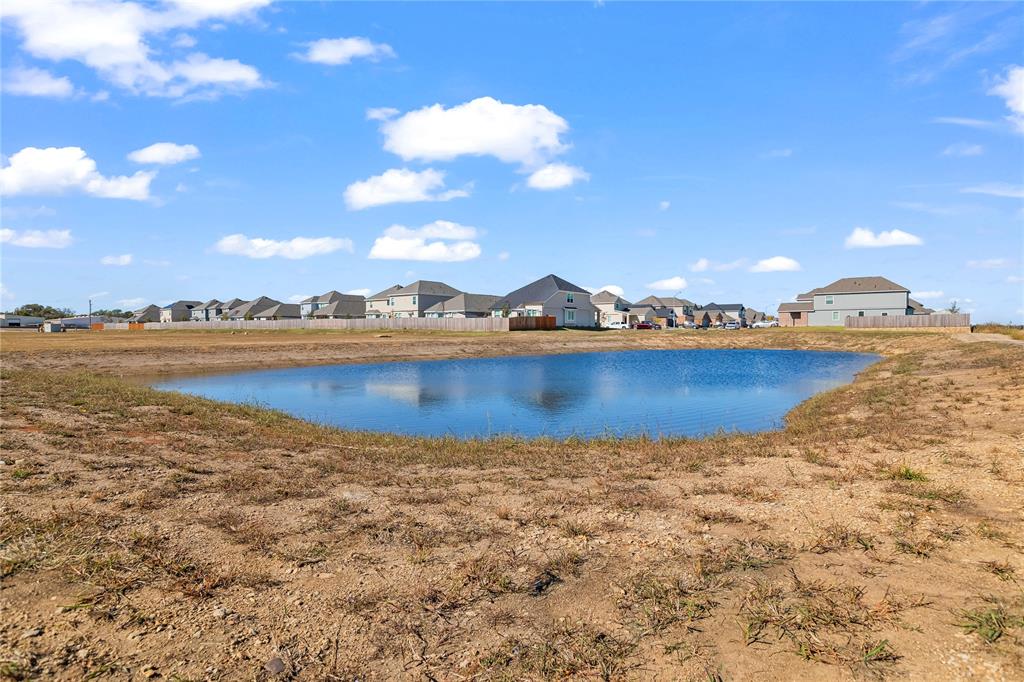 401 Thompson Place Everman, TX 76140 - Photo 23 of 23 a view of a lake with houses in the back