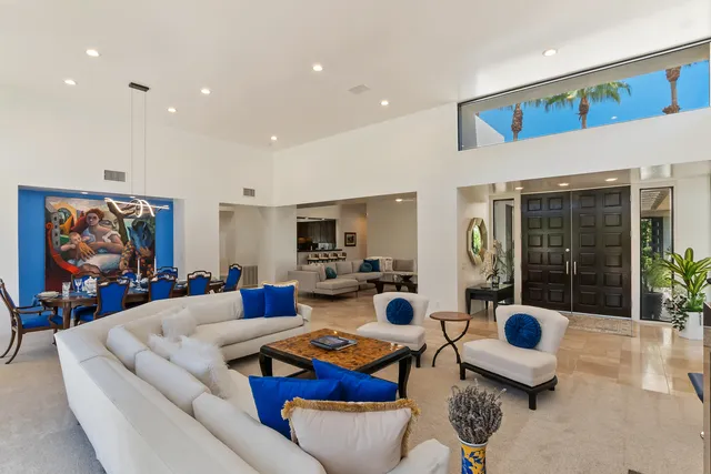 a bedroom with furniture and a flat screen tv