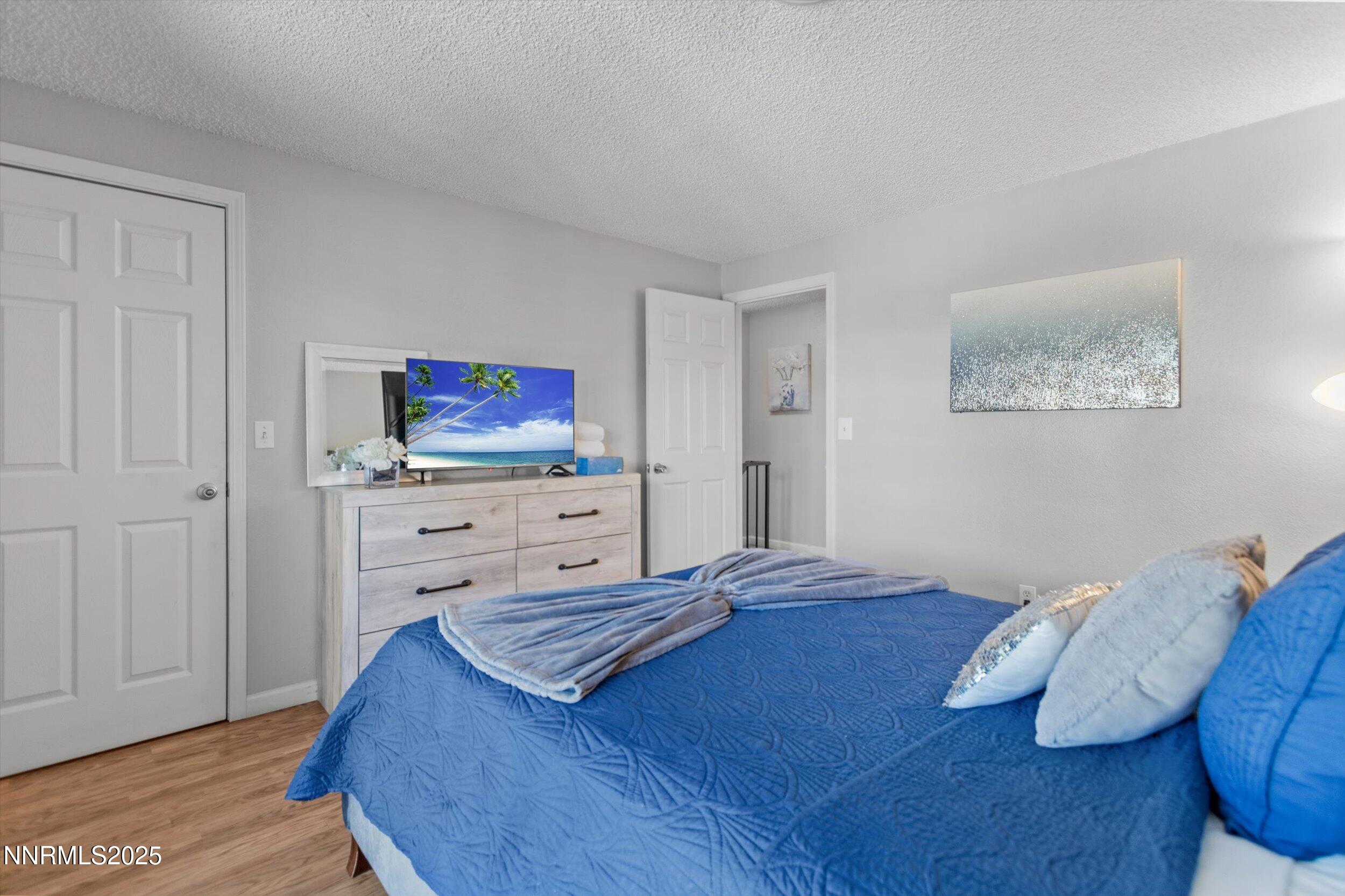 400 Claremont Street Reno, NV 89502 - Photo 11 of 32 a bedroom with a bed and flat screen tv