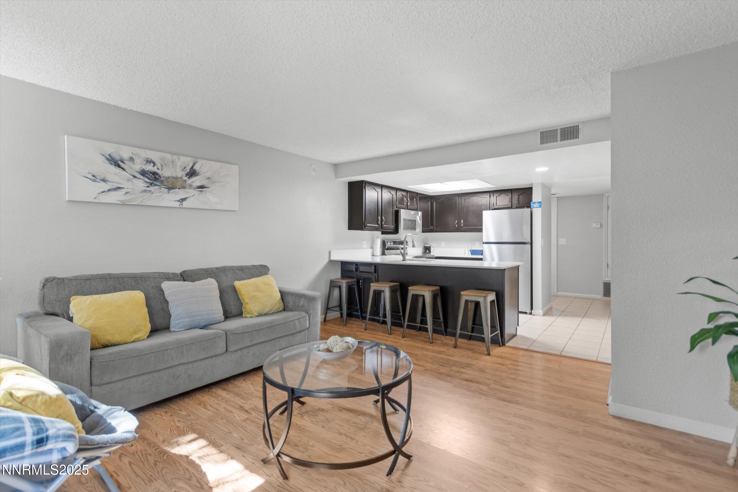 400 Claremont Street Reno, NV 89502 - Photo 18 of 32 a living room with furniture and a kitchen view