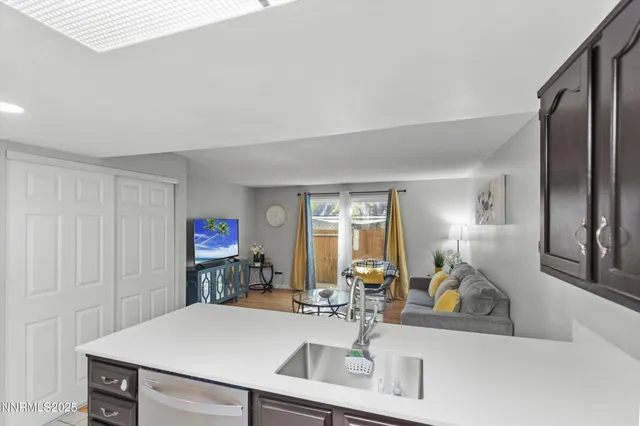 a kitchen with a refrigerator a sink and a stove