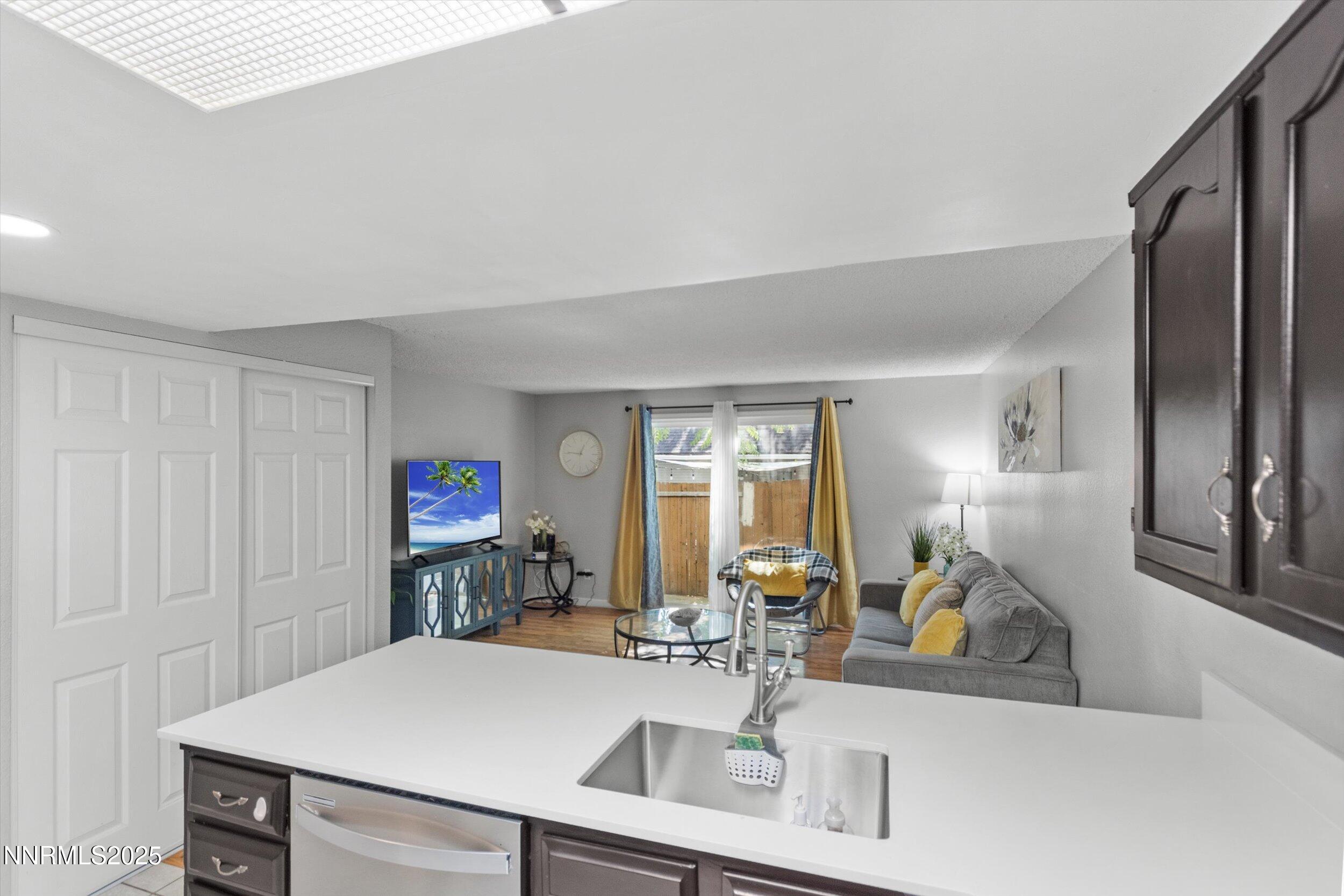 400 Claremont Street Reno, NV 89502 - Photo 28 of 32 a view of a kitchen with kitchen island a sink and a refrigerator