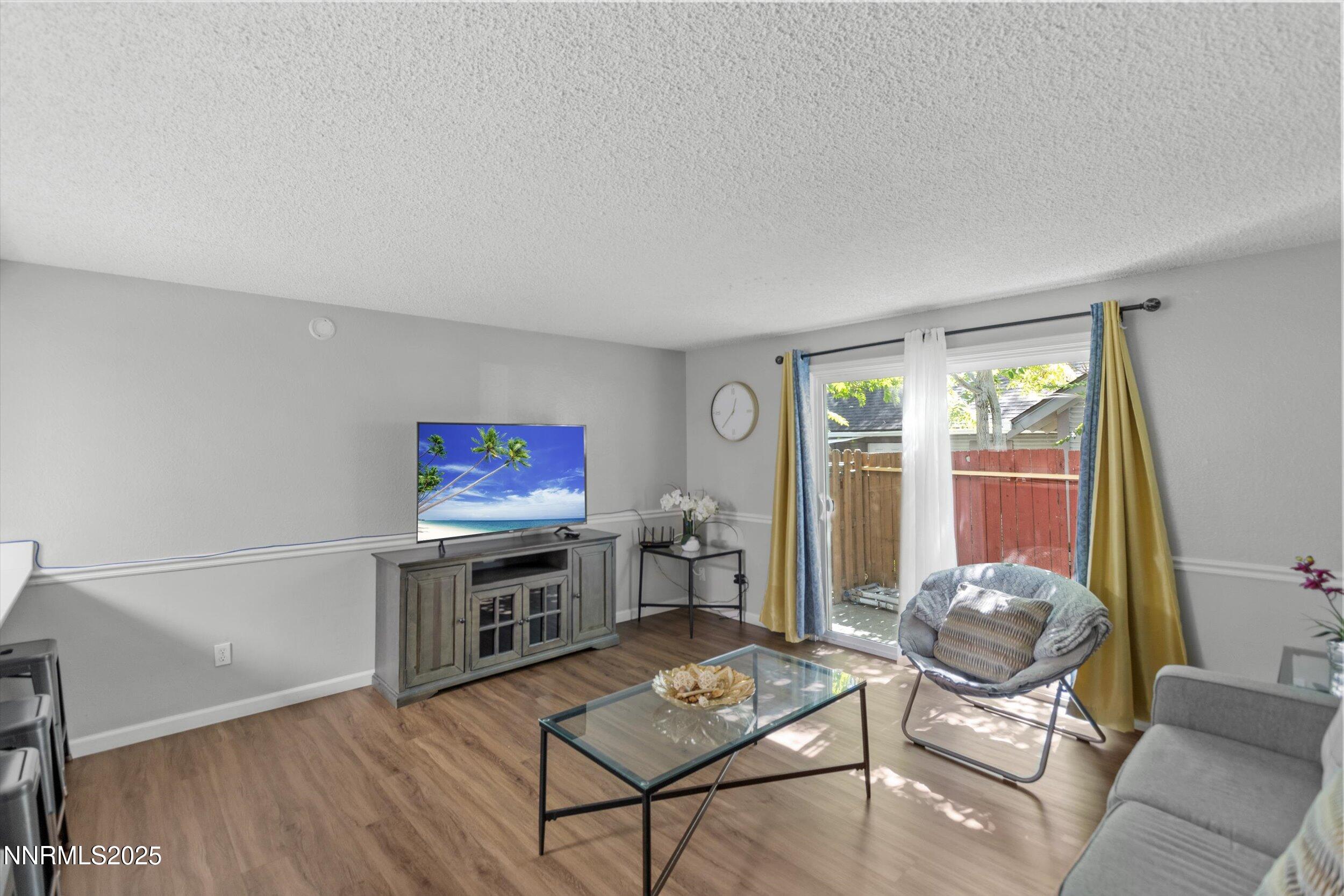 400 Claremont Street Reno, NV 89502 - Photo 30 of 32 a living room with furniture and a flat screen tv