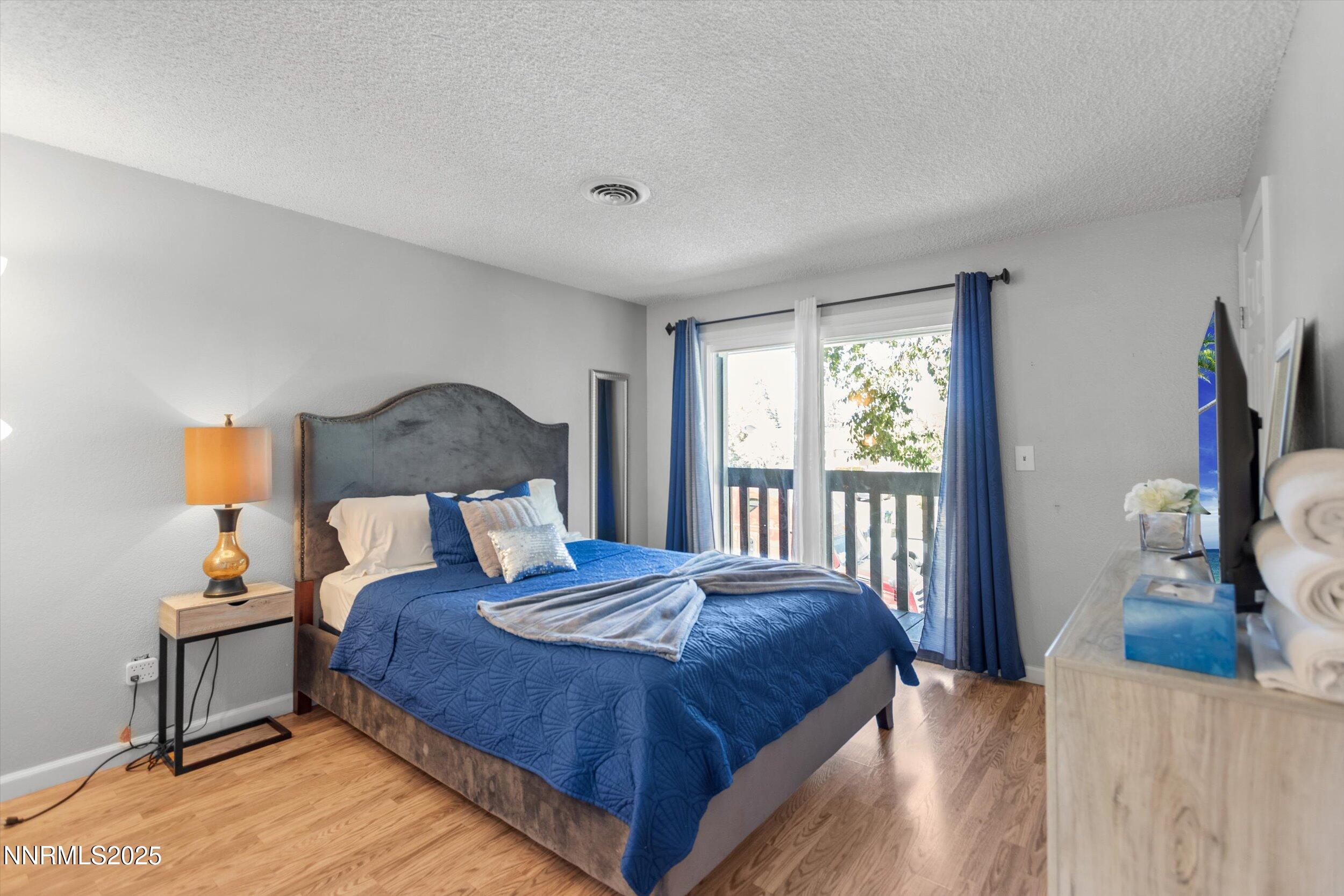 400 Claremont Street Reno, NV 89502 - Photo 10 of 32 a bedroom with a bed and a window